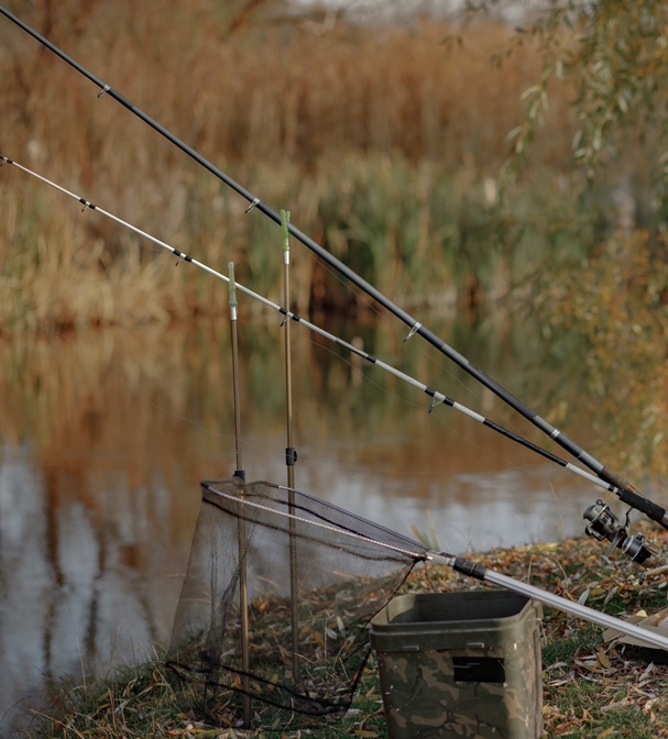 Handsome man near river in a morning fishing